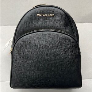 Michael Kors brand new w tags Abbey Black Leather zippered Backpack.
